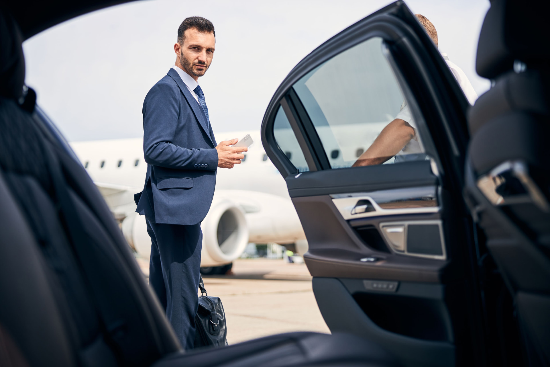 Goldwing client arriving by private plane, welcomed by a chauffeured car